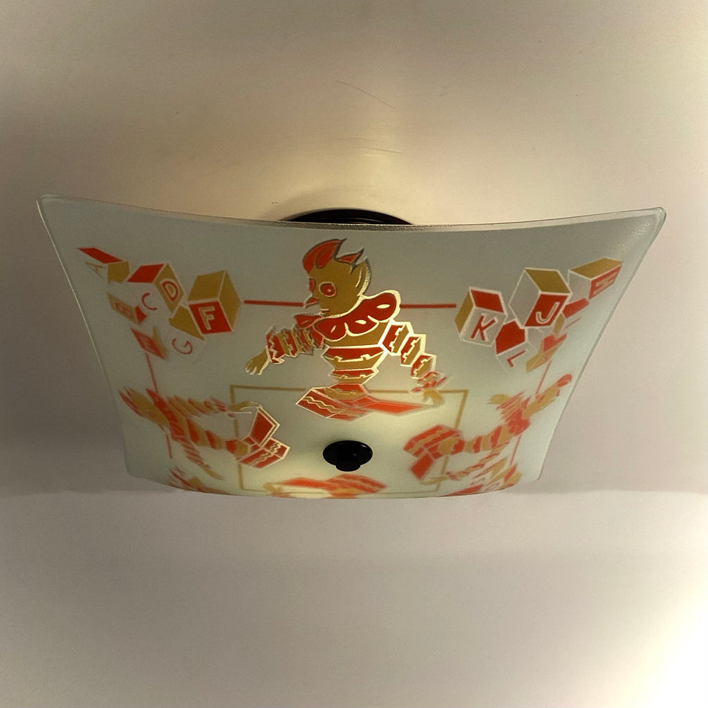 Square frosted glass ceiling light shade featuring vintage nursery clowns and alphabet blocks, illuminated from within.