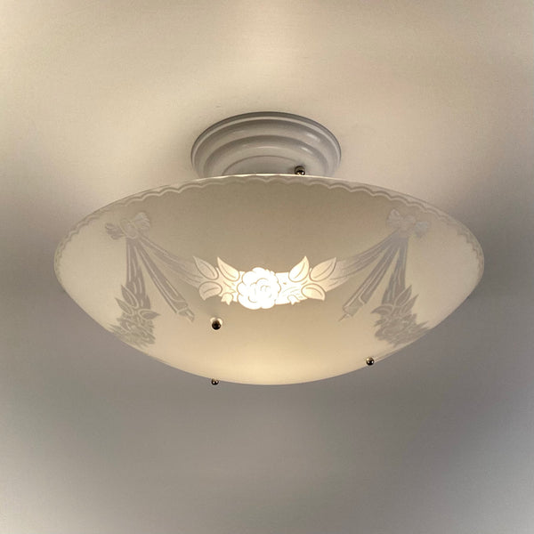 Vintage 1950s semi-flush ceiling light with enameled floral glass bowl illuminated, restored postwar ceiling fixture installed on white ceiling from Vintporium