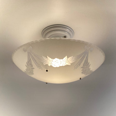 Vintage 1950s semi-flush ceiling light with enameled floral glass bowl illuminated, restored postwar ceiling fixture installed on white ceiling from Vintporium