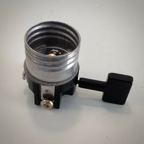 Leviton 3-way turn knob lamp socket interior replacement with black paddle switch knob and brass screw terminal.