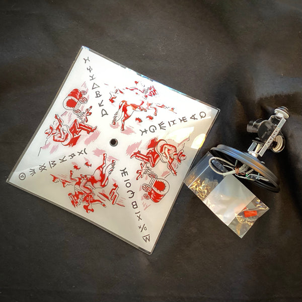 Square vintage Western glass light shade laid flat next to its included mounting hardware fixture and wiring components.
