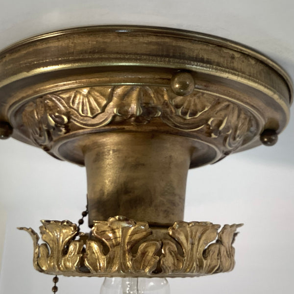 Antique Brass Flush Mount Ceiling Light with Pull Chain. The fixture has been rewired, cleaned, and detailed and retains much of its aging and wear. It also includes the hardware for easy installation. Available at www.vintporium.com