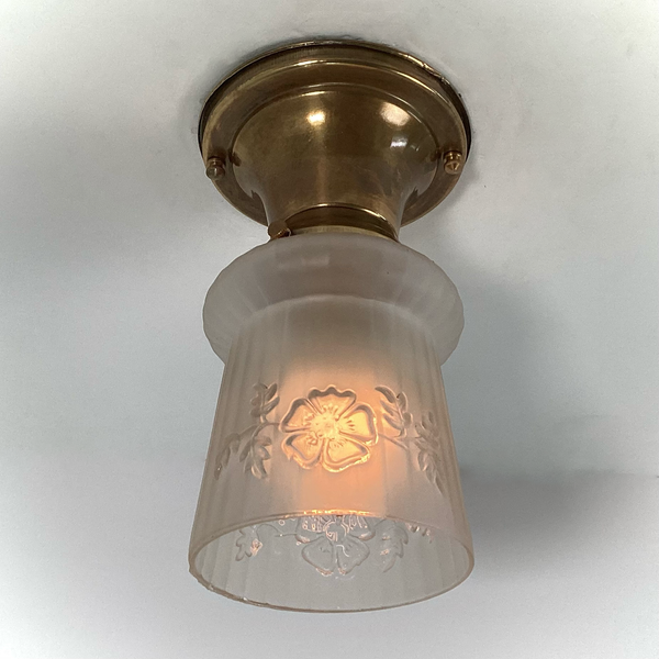 Vintage 1930s Empire Glass Ceiling Light – Floral Frosted Shade. 1930s with this charming flush mount ceiling light. Featuring a softly patinated brass canopy and a frosted glass shade adorned with embossed wildflowers and vertical fluting. Available at www.vintporium