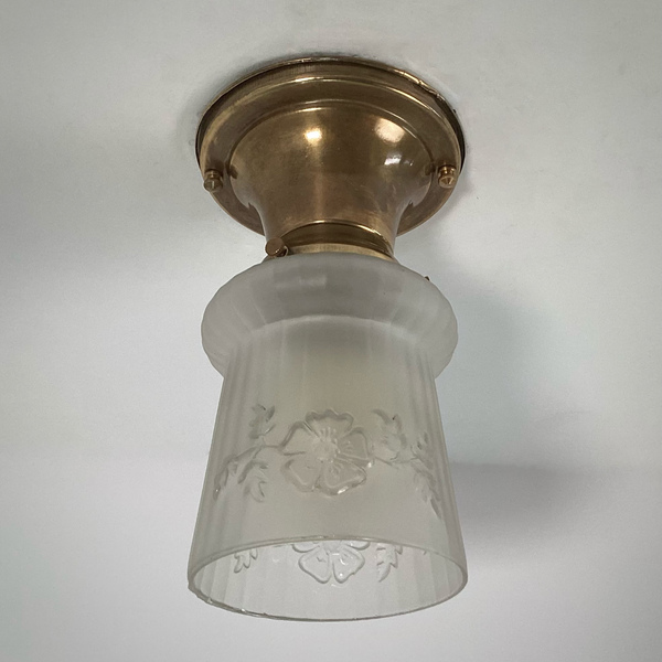 Vintage 1930s Empire Glass Ceiling Light – Floral Frosted Shade. 1930s with this charming flush mount ceiling light. Featuring a softly patinated brass canopy and a frosted glass shade adorned with embossed wildflowers and vertical fluting. Available at www.vintporium