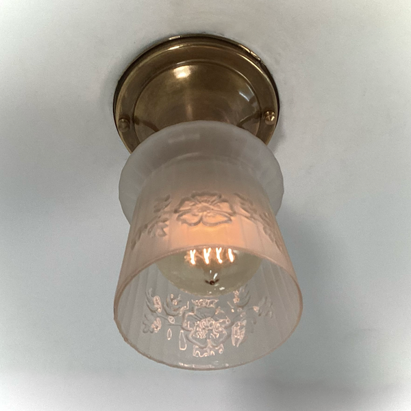 Vintage 1930s Empire Glass Ceiling Light – Floral Frosted Shade. 1930s with this charming flush mount ceiling light. Featuring a softly patinated brass canopy and a frosted glass shade adorned with embossed wildflowers and vertical fluting. Available at www.vintporium