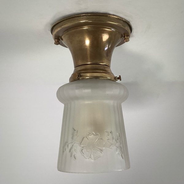 Vintage 1930s Empire Glass Ceiling Light – Floral Frosted Shade. 1930s with this charming flush mount ceiling light. Featuring a softly patinated brass canopy and a frosted glass shade adorned with embossed wildflowers and vertical fluting. Available at www.vintporium