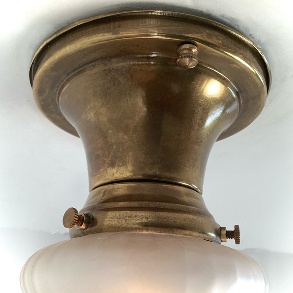 Vintage 1930s Empire Glass Ceiling Light – Floral Frosted Shade. 1930s with this charming flush mount ceiling light. Featuring a softly patinated brass canopy and a frosted glass shade adorned with embossed wildflowers and vertical fluting. Available at www.vintporium