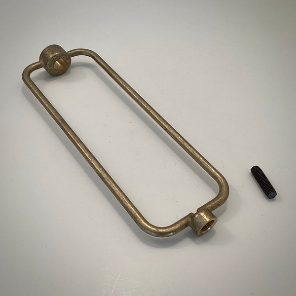 Unfinished solid cast brass boudoir lamp harp shown with set screw detached.