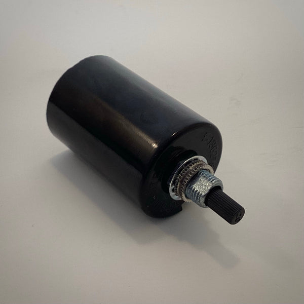 Rear angle view of a black Sun-Lite Bakelite lamp socket highlighting the threaded nipple, star washer, knurled lock ring, and black plastic rotary turn knob.