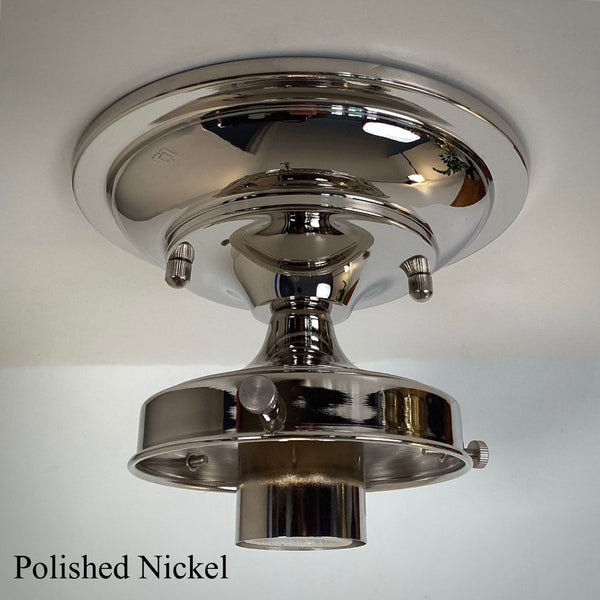 Polished nickel 4-inch fitter semi-flush light fixture shade holder part mounted on a ceiling canopy for glass shades.