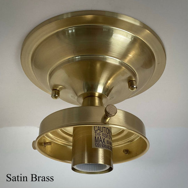 Satin brass 4-inch fitter semi-flush ceiling light fixture shade holder part attached to a matching canopy.