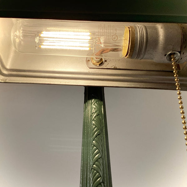 Antique Cast Iron Art Deco Bankers Lamp. This unique antique 1920s desk lamp, with its distinctive green enameled paint and brass highlights, is an outstanding piece. The fixture has been rewired, cleaned, and detailed for your convenience. Available at www.vintporium.com