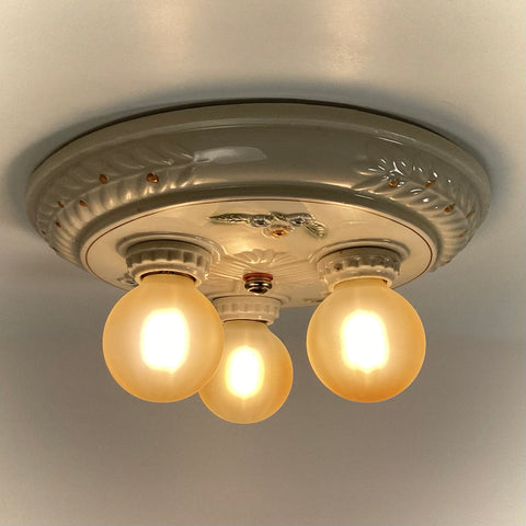 Antique Porcelain Flush Mount Pan Porcelain Ceiling Light Fixture. This beautiful antique porcelain ceiling light fixture features a classic 1930s design. The fixture has been restored and features new wiring, sockets, etc. It has been cleaned and detailed and is ready to install. Available at www.vintporium.com