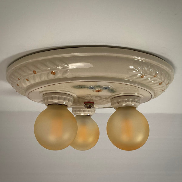 Antique Porcelain Flush Mount Pan Porcelain Ceiling Light Fixture. This beautiful antique porcelain ceiling light fixture features a classic 1930s design. The fixture has been restored and features new wiring, sockets, etc. It has been cleaned and detailed and is ready to install. Available at www.vintporium.com