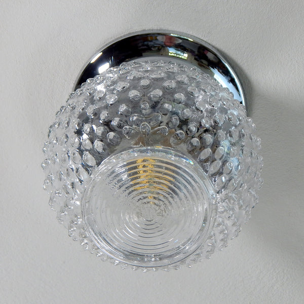 The term "hobnail" refers to the decorative raised bumps or knobs that adorn the surface of the glassware, resembling the shape of nail heads. Hobnail glass originated from Europe and was initially produced during the Victorian era in the 19th century. However, it experienced a resurgence in popularity after World War II, particularly in the United States.  Available at www.vintporium.com