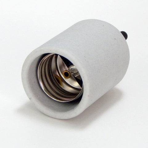 Porcelain Turn Knob Medium Base Socket. A great replacement for those worn and crusty bakelite turn knob sockets that are found on vintage tv lamps and table lamps. The socket features a wire access hole on the back side, making it easy to rewire. Available at www.vintporium.com