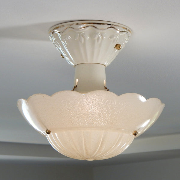 The antique semi-flush porcelain beaded chain drop-down ceiling light fixture has been rewired, cleaned, detailed, and includes installation hardware making it convenient to install. Available at www.vintporium.com