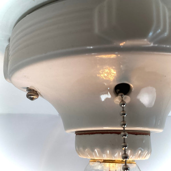 Vintage Deco Flush Mount Ceiling Light Fixture with Pull Chain. This vintage deco porcelain light fixture has been restored and features a new porcelain pull chain socket, wiring, etc. The fixture has been cleaned and detailed, making for a convenient installation.