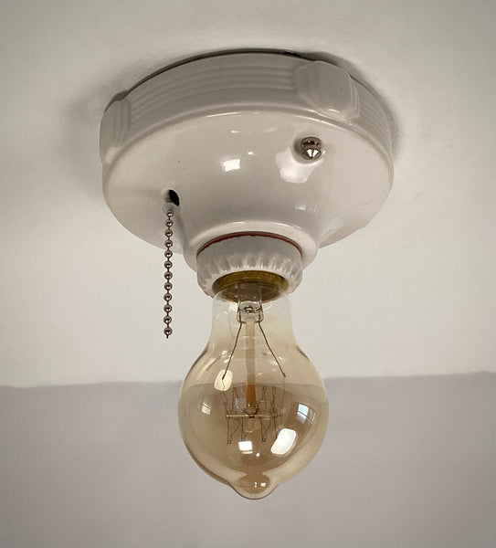 Vintage Deco Flush Mount Ceiling Light Fixture with Pull Chain. This vintage deco porcelain light fixture has been restored and features a new porcelain pull chain socket, wiring, etc. The fixture has been cleaned and detailed, making for a convenient installation.