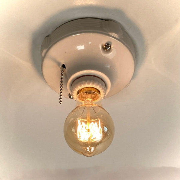 Vintage Deco Flush Mount Ceiling Light Fixture with Pull Chain. This vintage deco porcelain light fixture has been restored and features a new porcelain pull chain socket, wiring, etc. The fixture has been cleaned and detailed, making for a convenient installation.