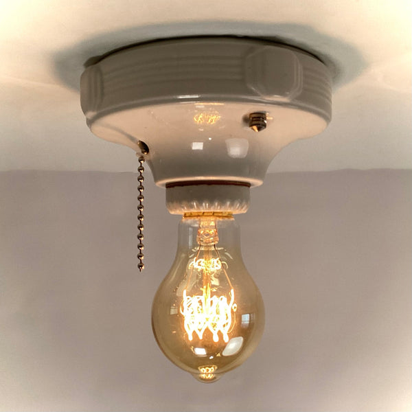 Vintage Deco Flush Mount Ceiling Light Fixture with Pull Chain. This vintage deco porcelain light fixture has been restored and features a new porcelain pull chain socket, wiring, etc. The fixture has been cleaned and detailed, making for a convenient installation.