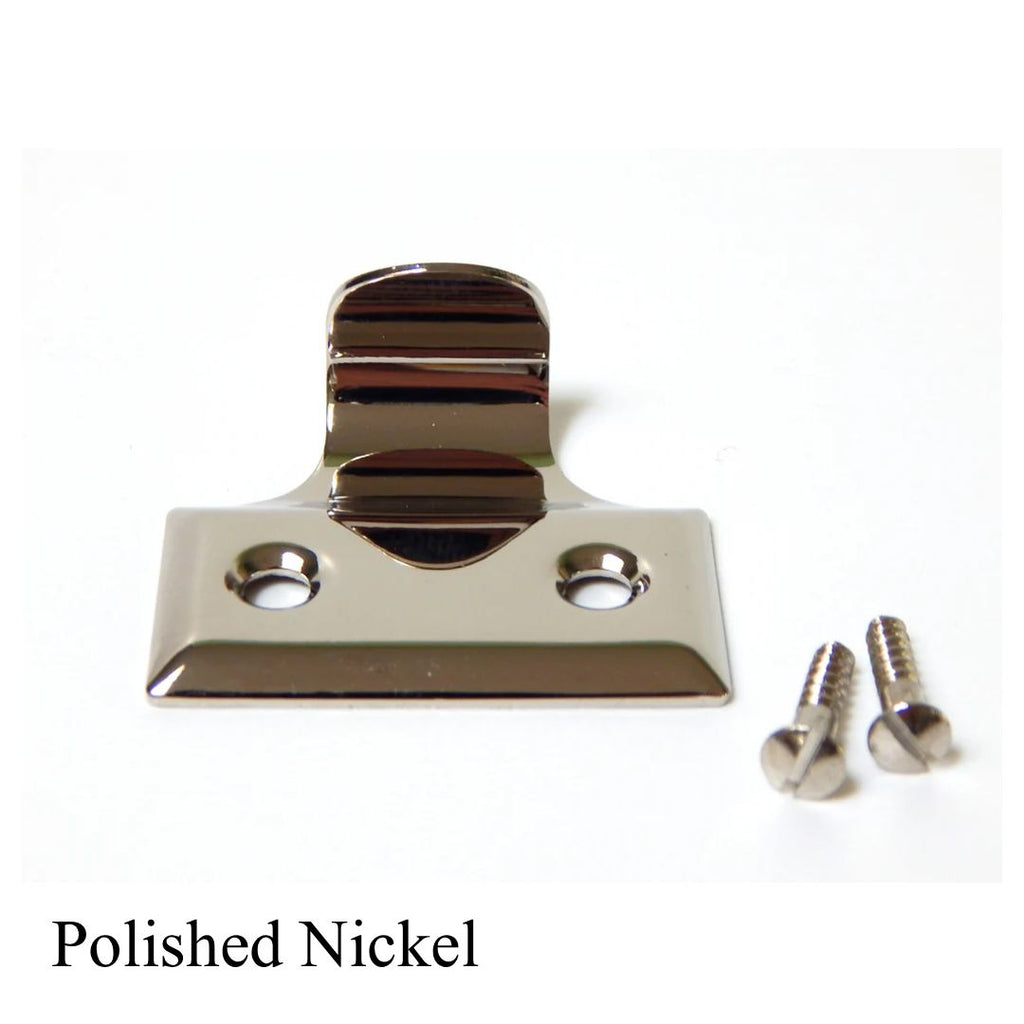 Polished nickel sash lift handle for double-hung windows with matching silver mounting screws.