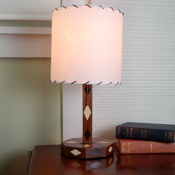 The vintage 1950s table lamp lacks any manufacturer names so its origin story is unknown. Its been clean and oiled, rewired, and is ready to display in your home. Available at www.vintporium.com