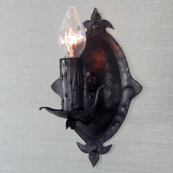 This 1930's antique sconce light fixture will fit well in any of the following Revival-style homes whether they be Spanish, Tudor, Storybook, or Craftsman. The fixture has been restored, detailed, and includes the hardware for easy installation. Available at www.vintporium.com
