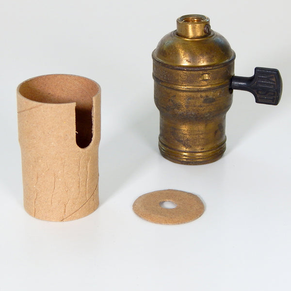 Set includes one paper insulator and one cap liner for medium base turn knob Fat-Boy socket. Fat Boy sockets have a larger base than more modern sockets and are found equipped on early lamps and fixtures. Available at www.vintporium.com